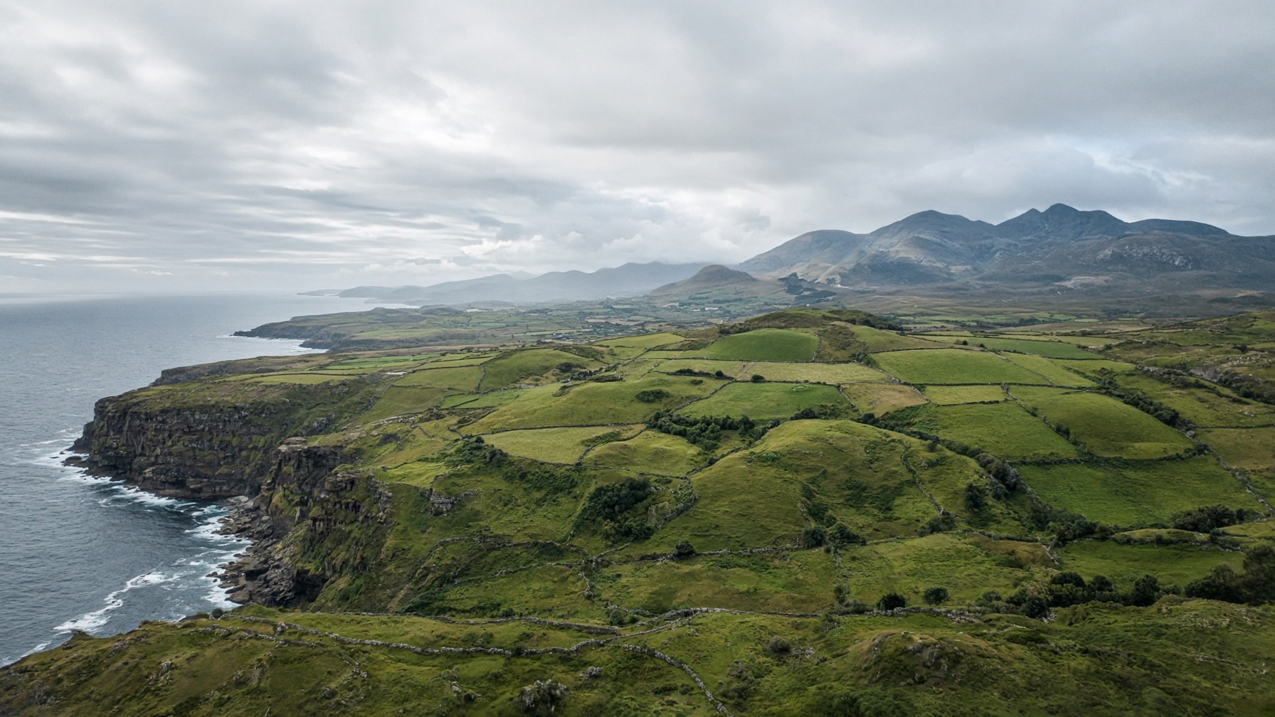 Landscape of the Ulster coast, farmland and mountains
